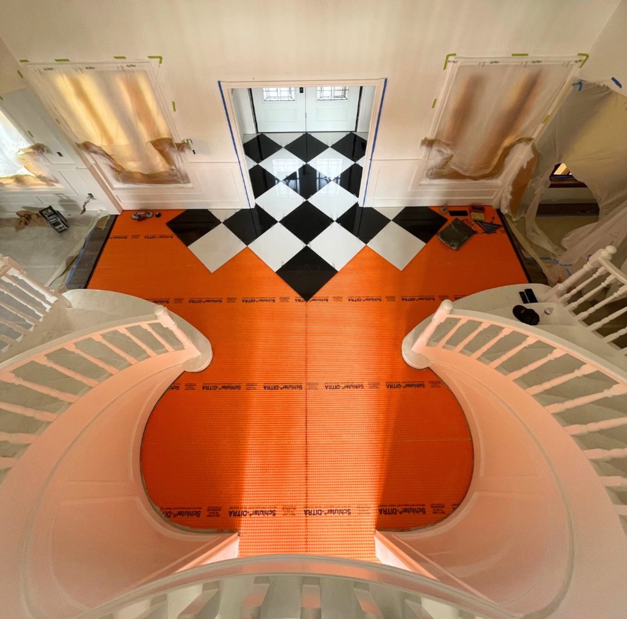 Checkerboard tile installation in progress