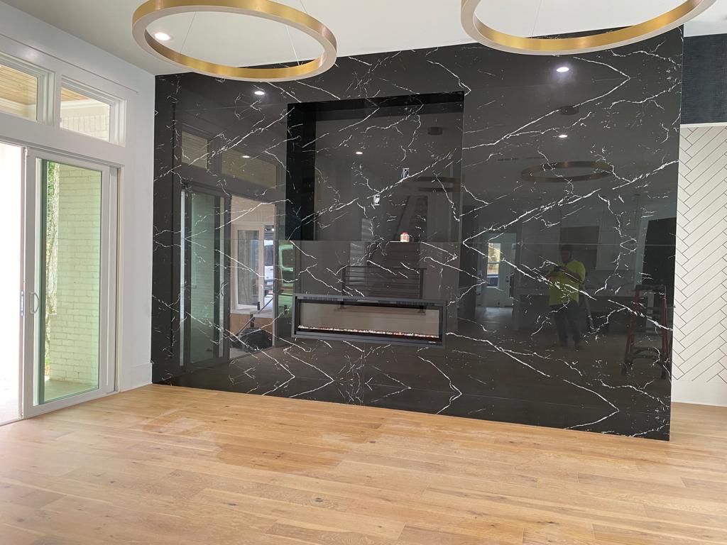 Black veined fireplace feature wall