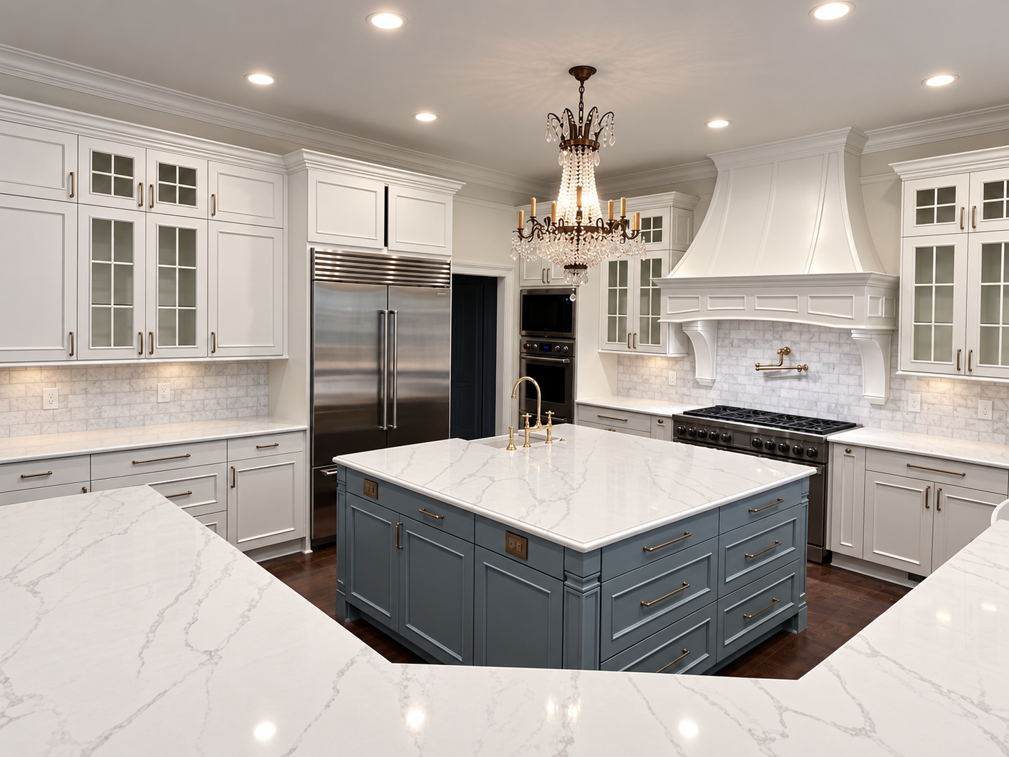 White kitchen with wood floor and quartz island