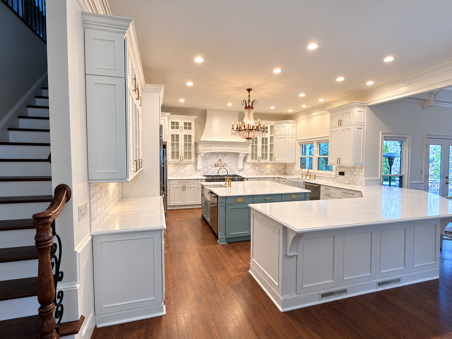 Bright white kitchen with two islands and wood flooring