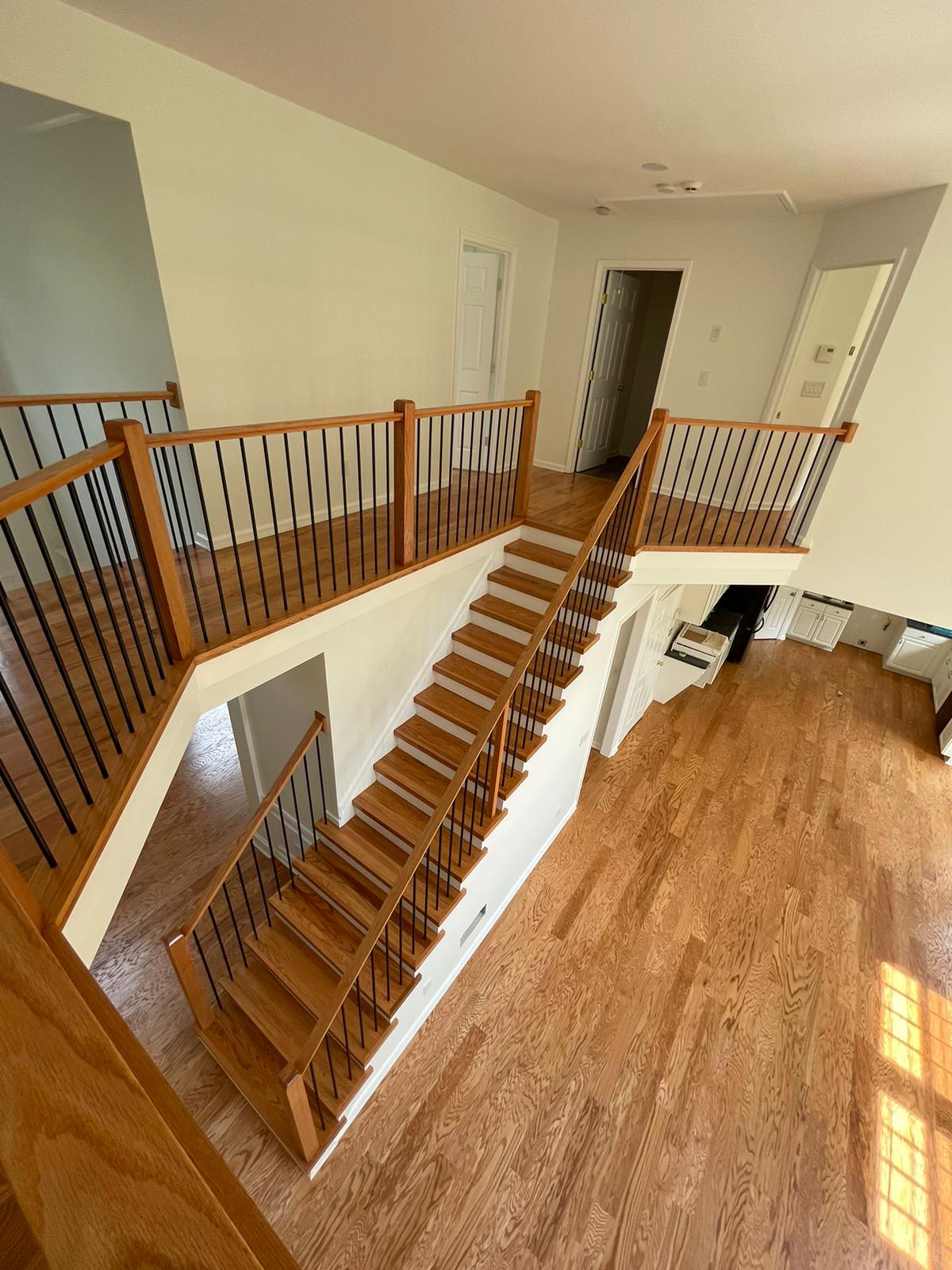 Wood staircase with black balusters